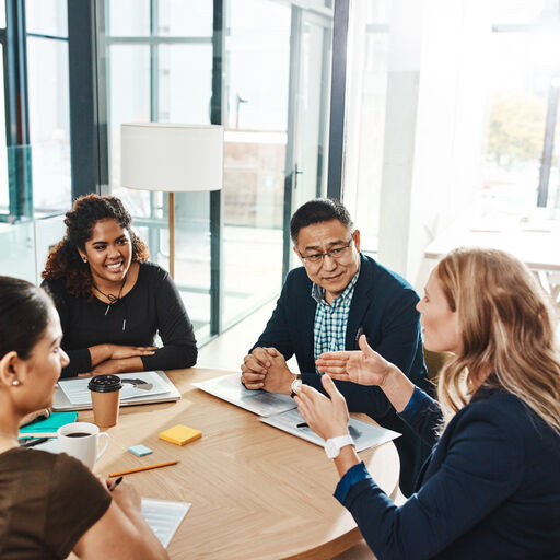 Employees around a desk